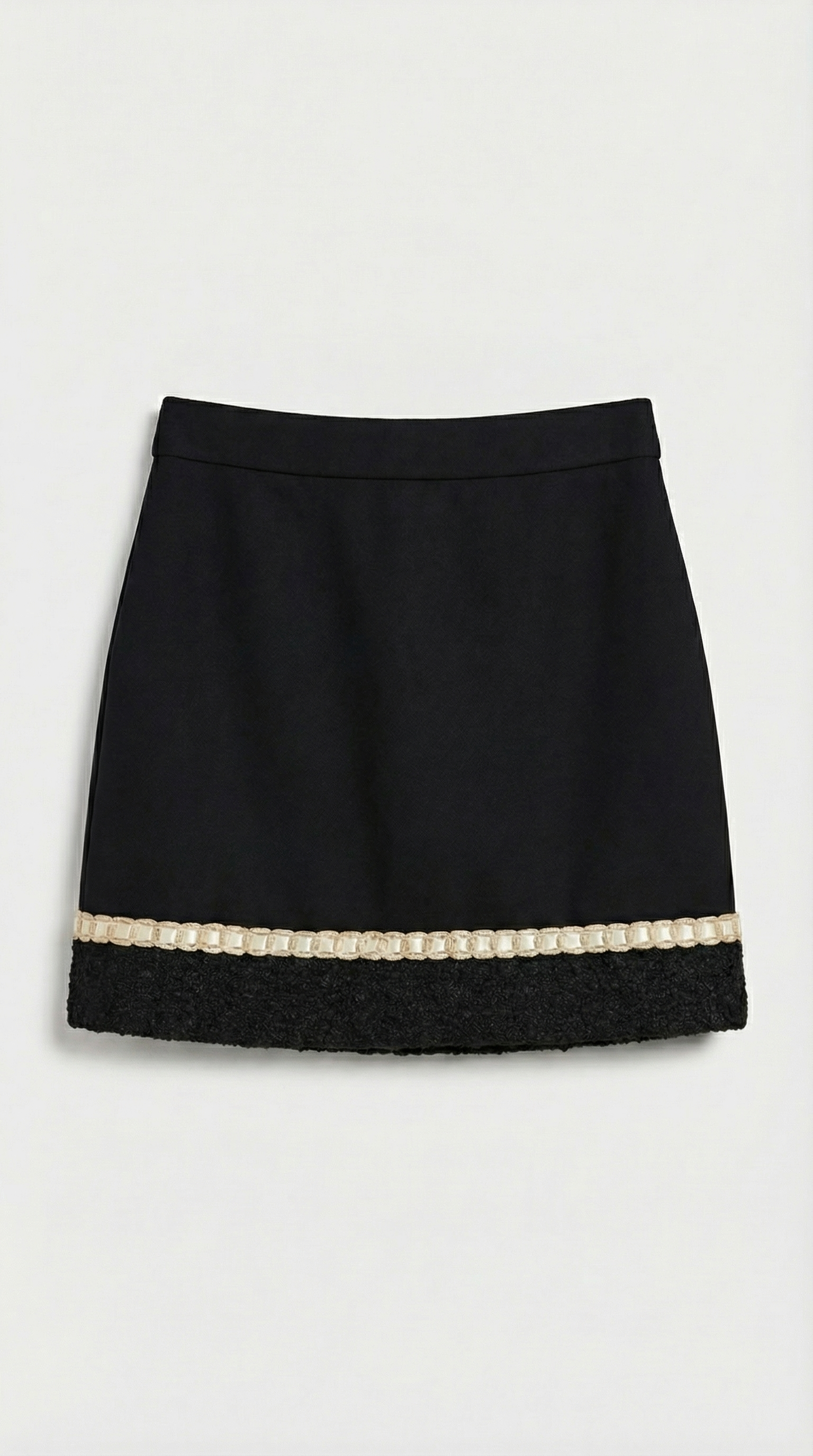 Ensemble tailleur en tweed noir Avelin, composé d'un haut et d'une mini-jupe trapèze. 