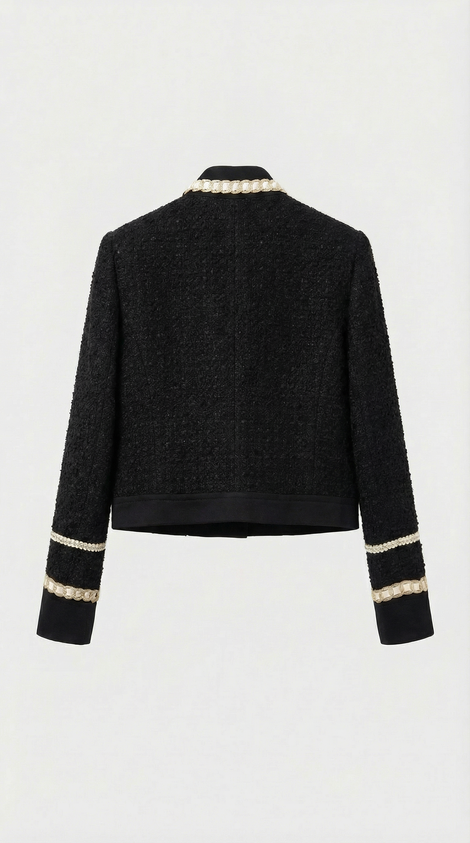 Ensemble tailleur en tweed noir Avelin, composé d'un haut et d'une mini-jupe trapèze. 
